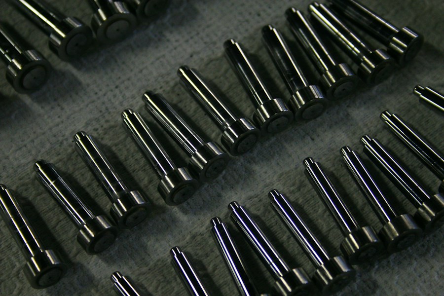 Dark finished precision metal components
